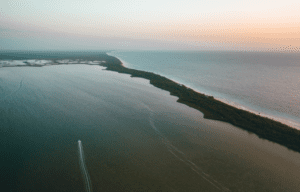 spit of land reaching out into the sea creating a boundary