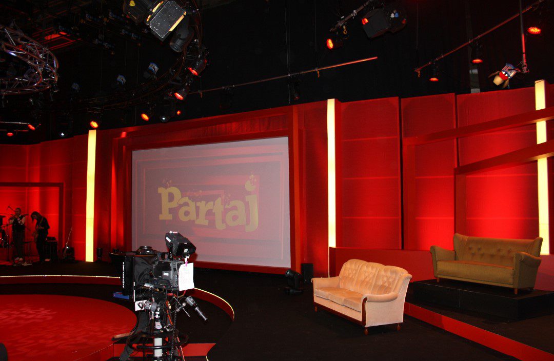 television studio set with empty sofas.