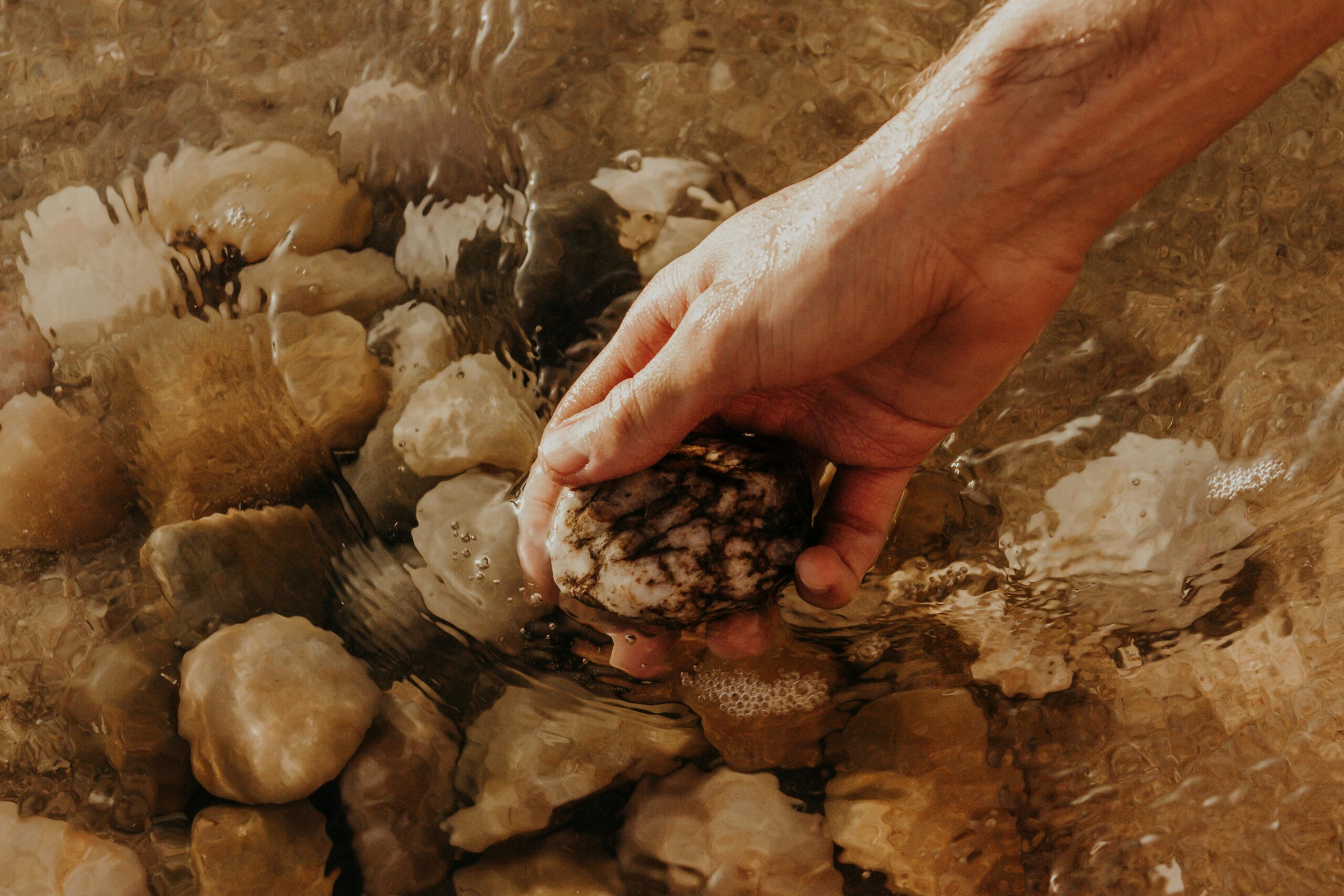 ands gently placing a heavy stone down by a peaceful river.<br />
